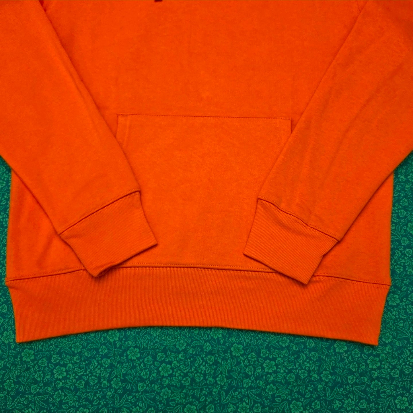 Supreme Satin Appliqué Hooded Sweatshirt in Bright Orange, featuring a large white satin logo running vertically down the back.