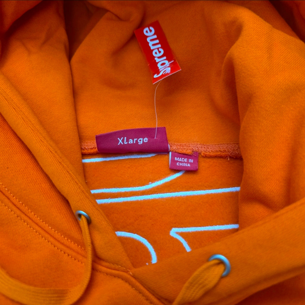 Supreme Satin Appliqué Hooded Sweatshirt in Bright Orange, featuring a large white satin logo running vertically down the back.
