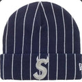 Supreme New Era Devil S Logo Beanie 'Stripe' from the Spring/Summer 2026 collection. It features a navy pinstripe acrylic knit design with an embroidered "S" logo detailed with devil horns.