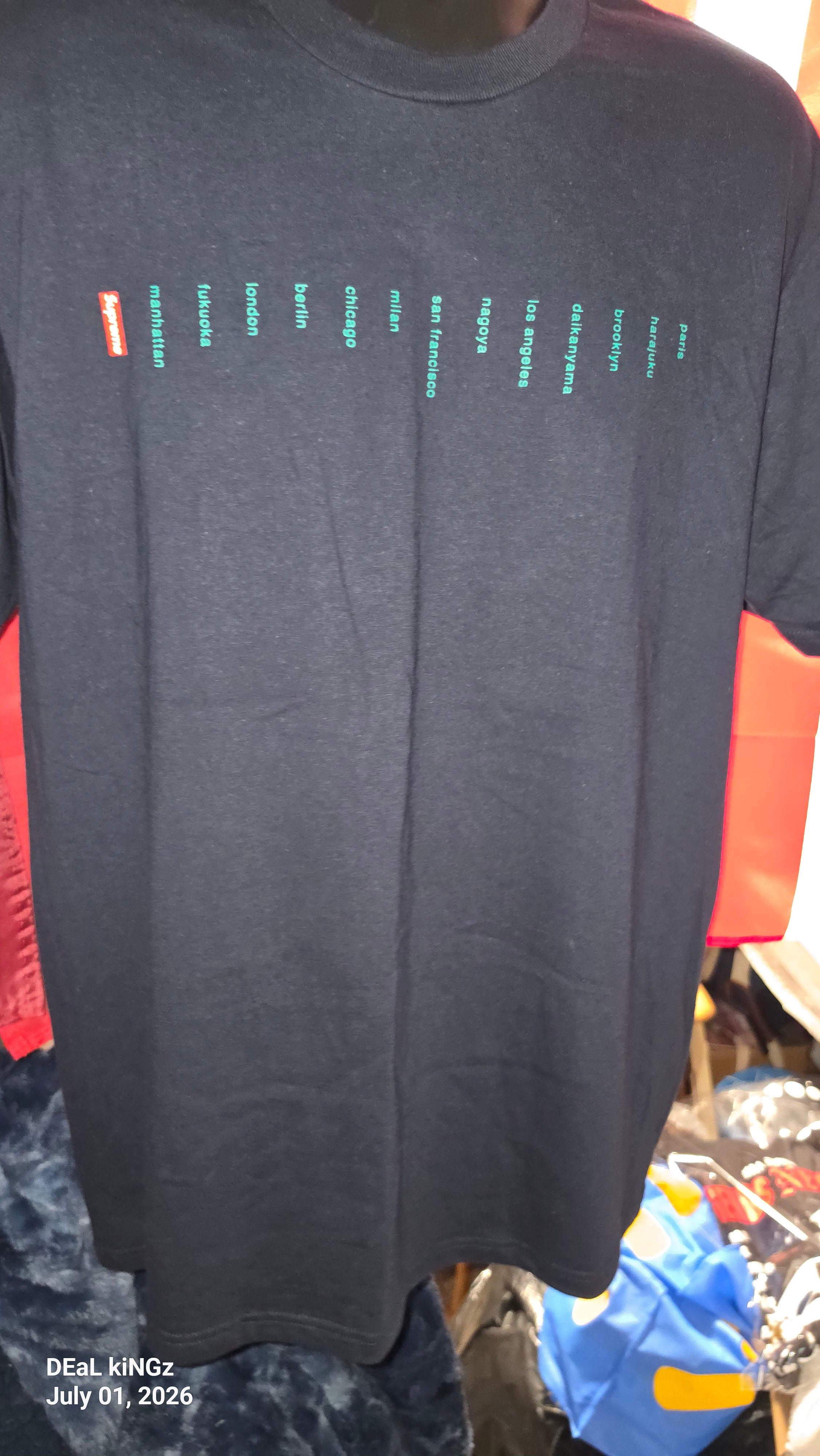 Supreme Location Tee in navy from the Spring/Summer 2023 collection, featuring a printed list of global store cities.