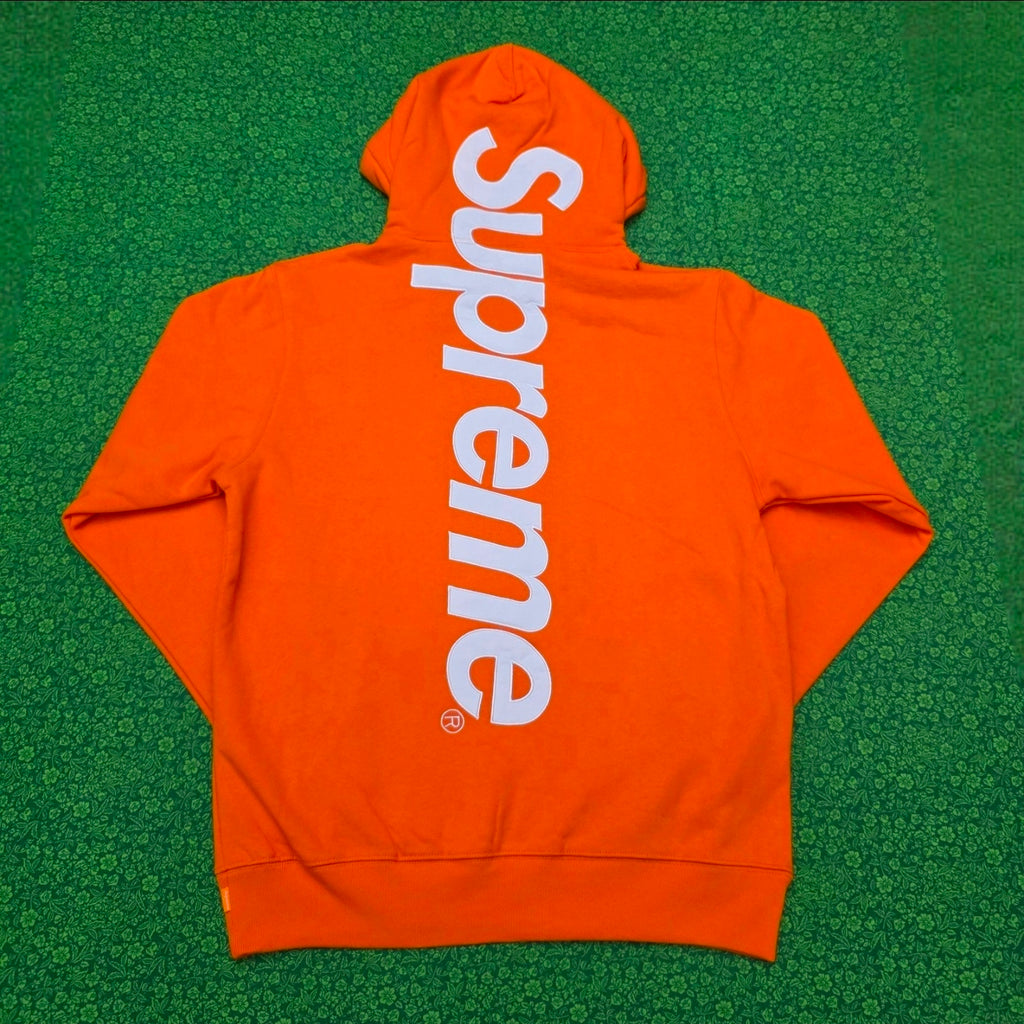 Supreme Satin Appliqué Hooded Sweatshirt in Bright Orange, featuring a large white satin logo running vertically down the back.